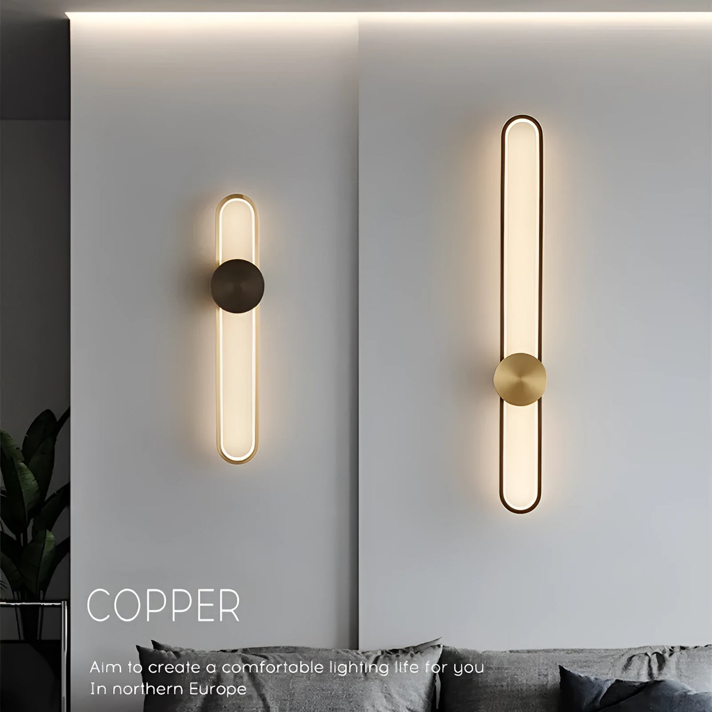 Round black iron wall sconce with integrated LED light glowing on a modern grey wall