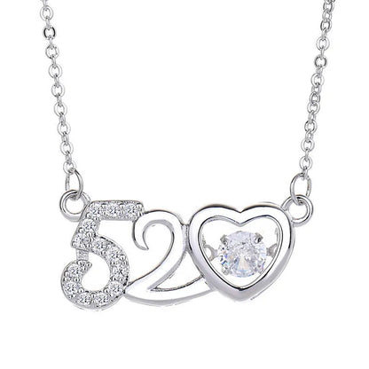 Sterling silver heart-shaped pendant necklace with a small crown and bow design, shown in a rose gold finish.