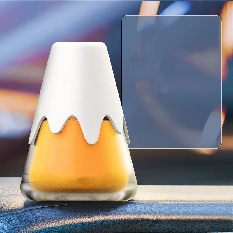Glass-cased car aromatherapy unit with solid fragrance cream, shown in purple colour variant.
