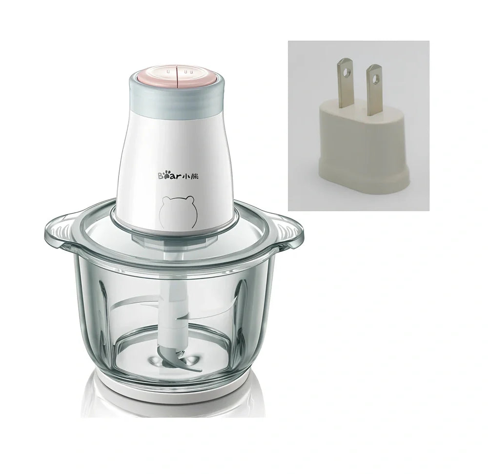 Household electric vegetable chopper blender with glass bowl and stainless steel blade on kitchen counter