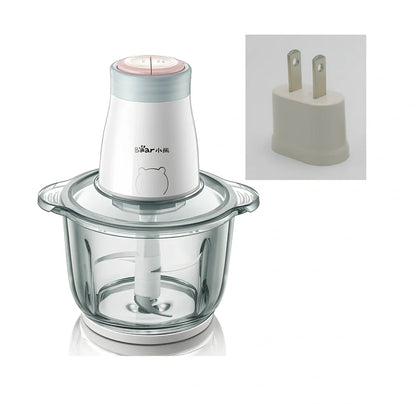 Household electric vegetable chopper blender with glass bowl and stainless steel blade on kitchen counter