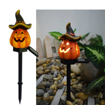 Solar-powered Halloween pumpkin lanterns lighting up a garden at night