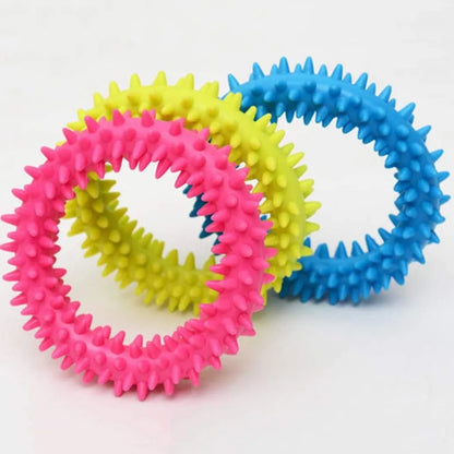 TPR spiky circle ring dog chew toy in assorted colours showing dental cleaning nubs
