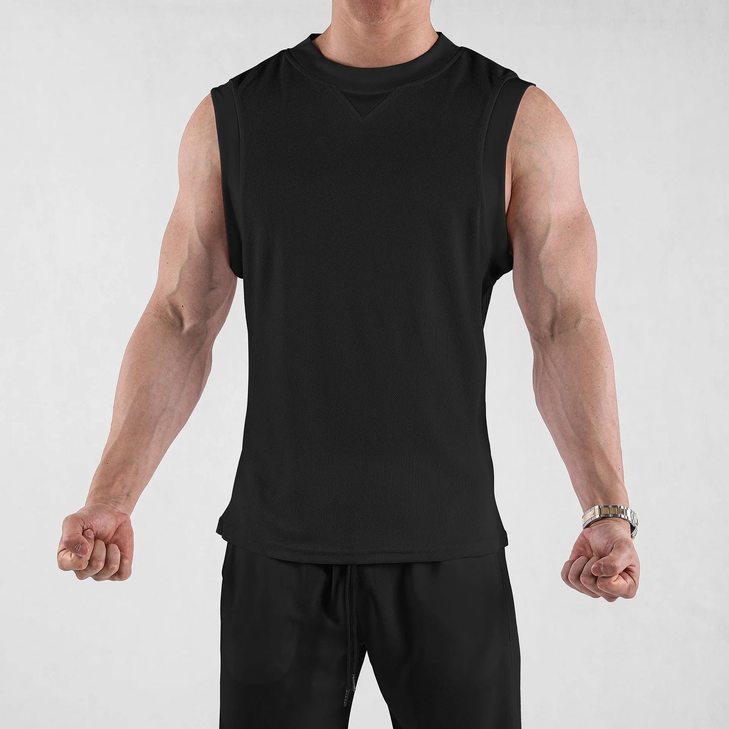 Men's black loose fit polyester fitness vest for summer sports on a white background