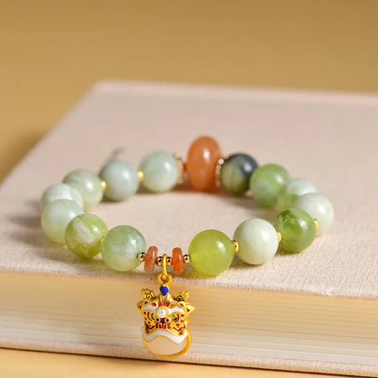 Green milk-in-water Xingshi jade pendant bracelet with geometric retro design on wrist