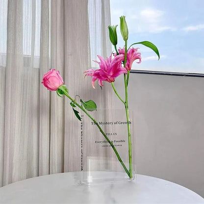 Transparent book-shaped acrylic vase, 22cm long with black font, refracting sunlight for home decor