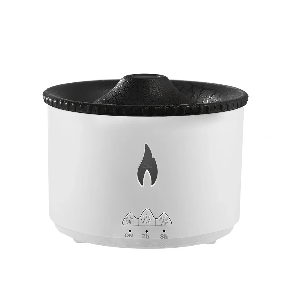 White volcano-shaped humidifier diffuser with flame lighting effect and remote control on wooden surface
