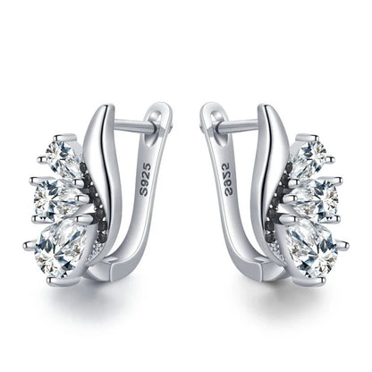 Elegant wing-shaped earrings with drop-shaped zircon stones, crafted with copper for a sophisticated and fashionable look