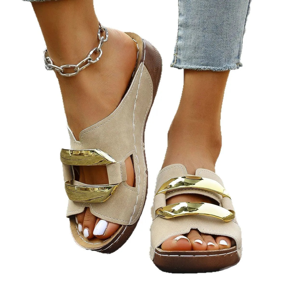 Roman style platform sandals in black with a flat heel and metal detail on the strap.