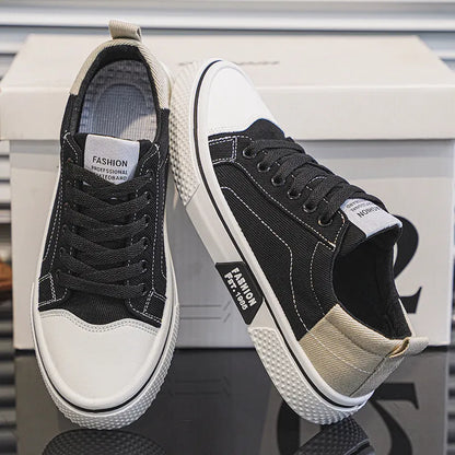 Men's low-top blue canvas skate shoes with round toe and flat heel on a white background.