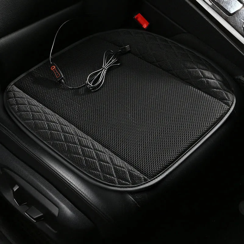 USB ventilated car seat cushion in black suede with leather trim, showing integrated cooling fans and power cable