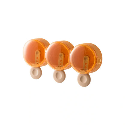 Food grade silicone doughnut ice cream mold in yellow, green, and purple