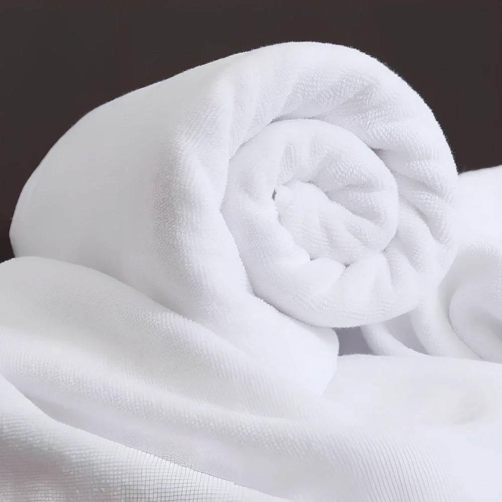 White hotel bath towel with thickened 100% cotton construction showing texture detail