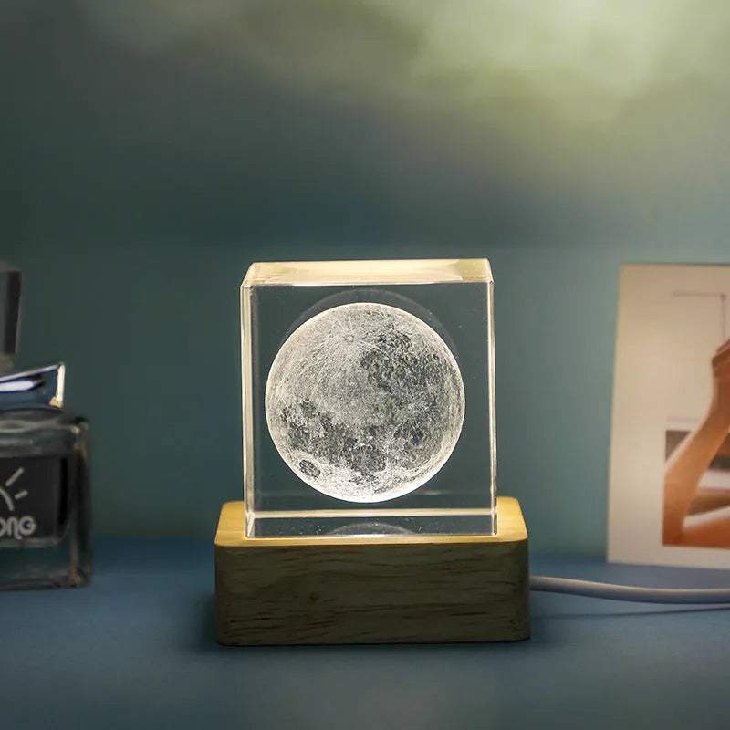3D crystal cube night lamp showing transparent glass with internal engraving and warm light illumination