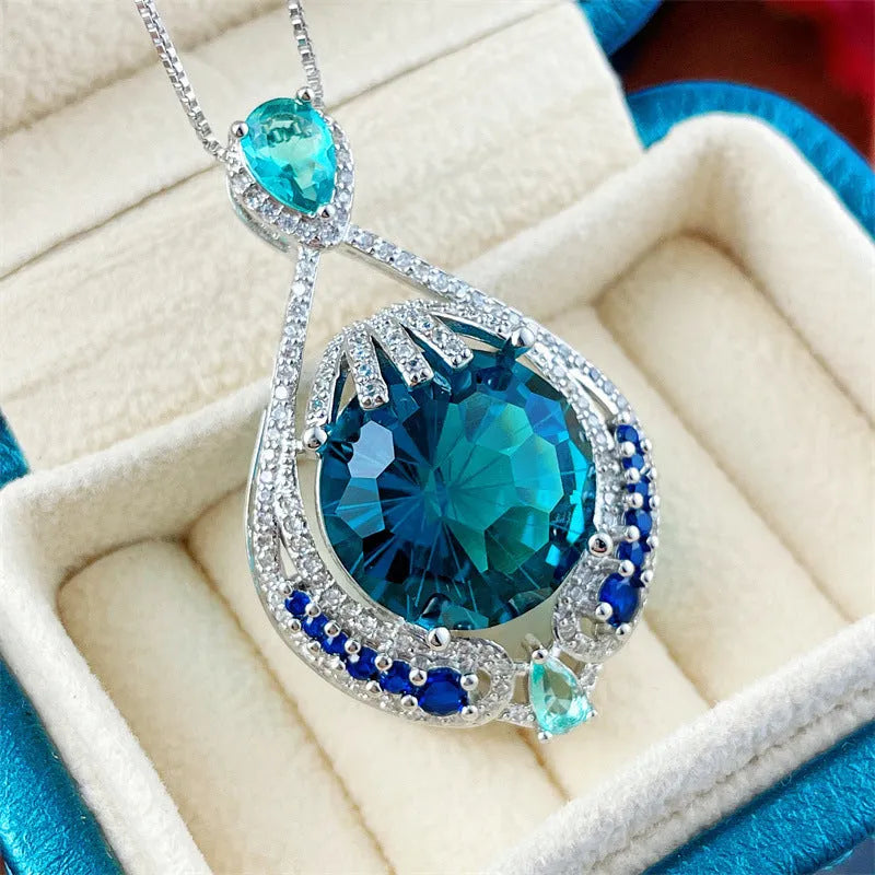 Women's blue crystal necklace with geometric fireworks-cut pendant on water wave alloy chain