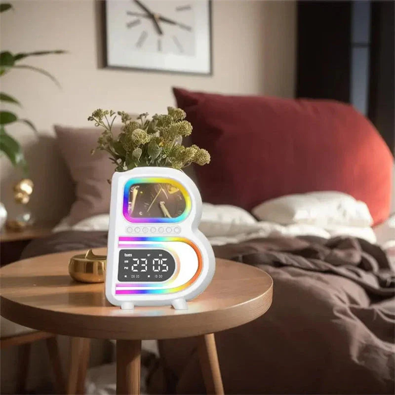 B-shaped Bluetooth speaker with wireless charging, adjustable lighting, and alarm clock functionality