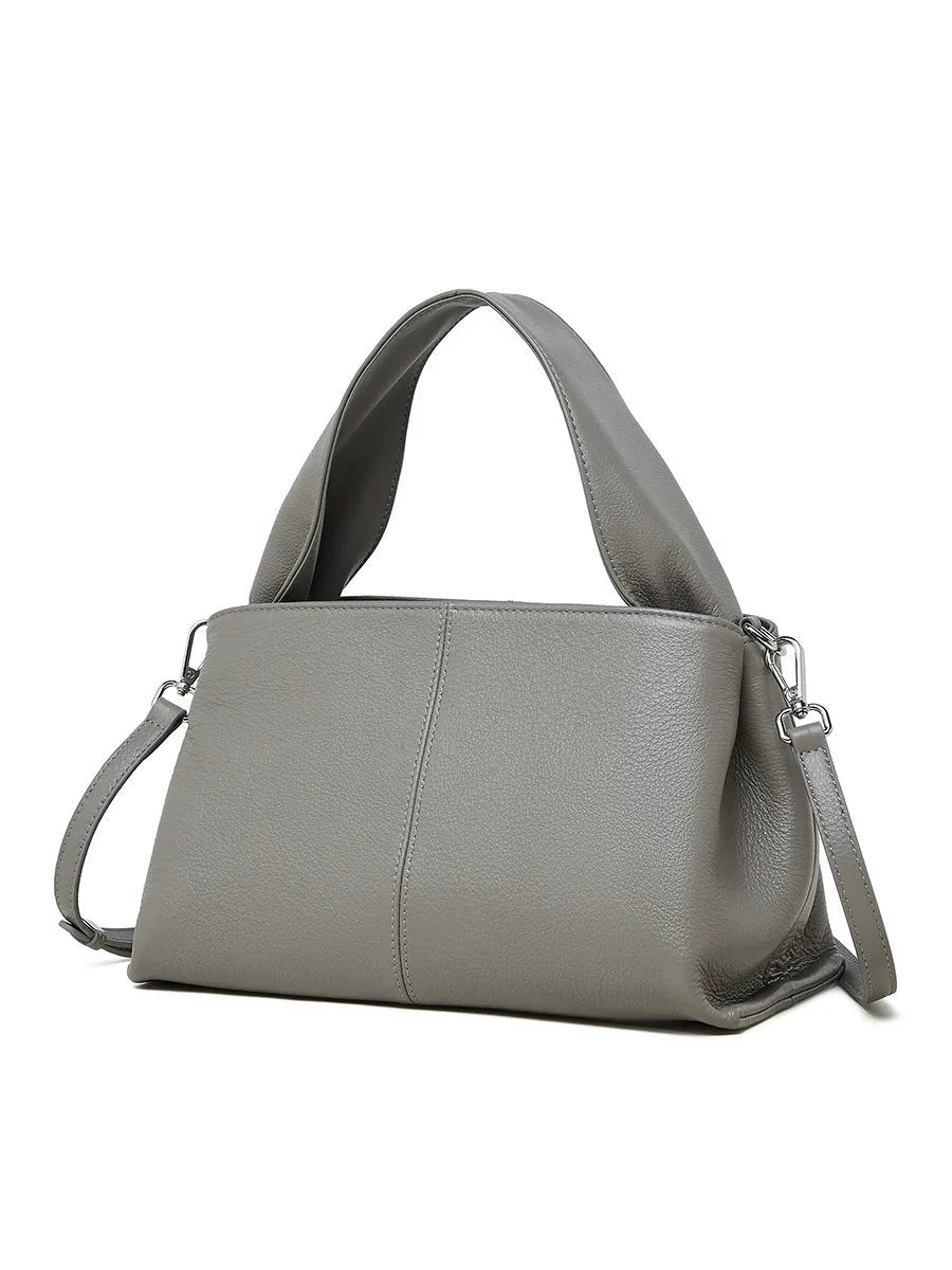 Women's genuine cowhide retro texture messenger bag in horizontal square shape, shown in apricot colour with double shoulder straps.