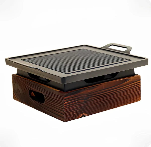 Korean baking pan set with four different sized pans in wooden storage block