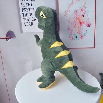 Green dinosaur plush toy with reversible sequins showing flipped design patterns