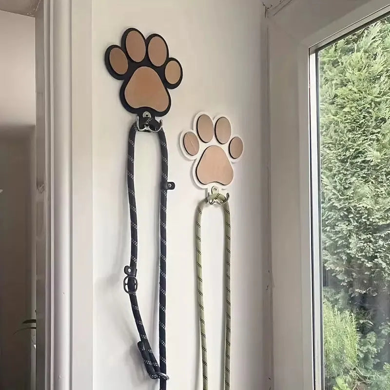 Black and white wooden paw print shaped wall hook for hanging keys or coats
