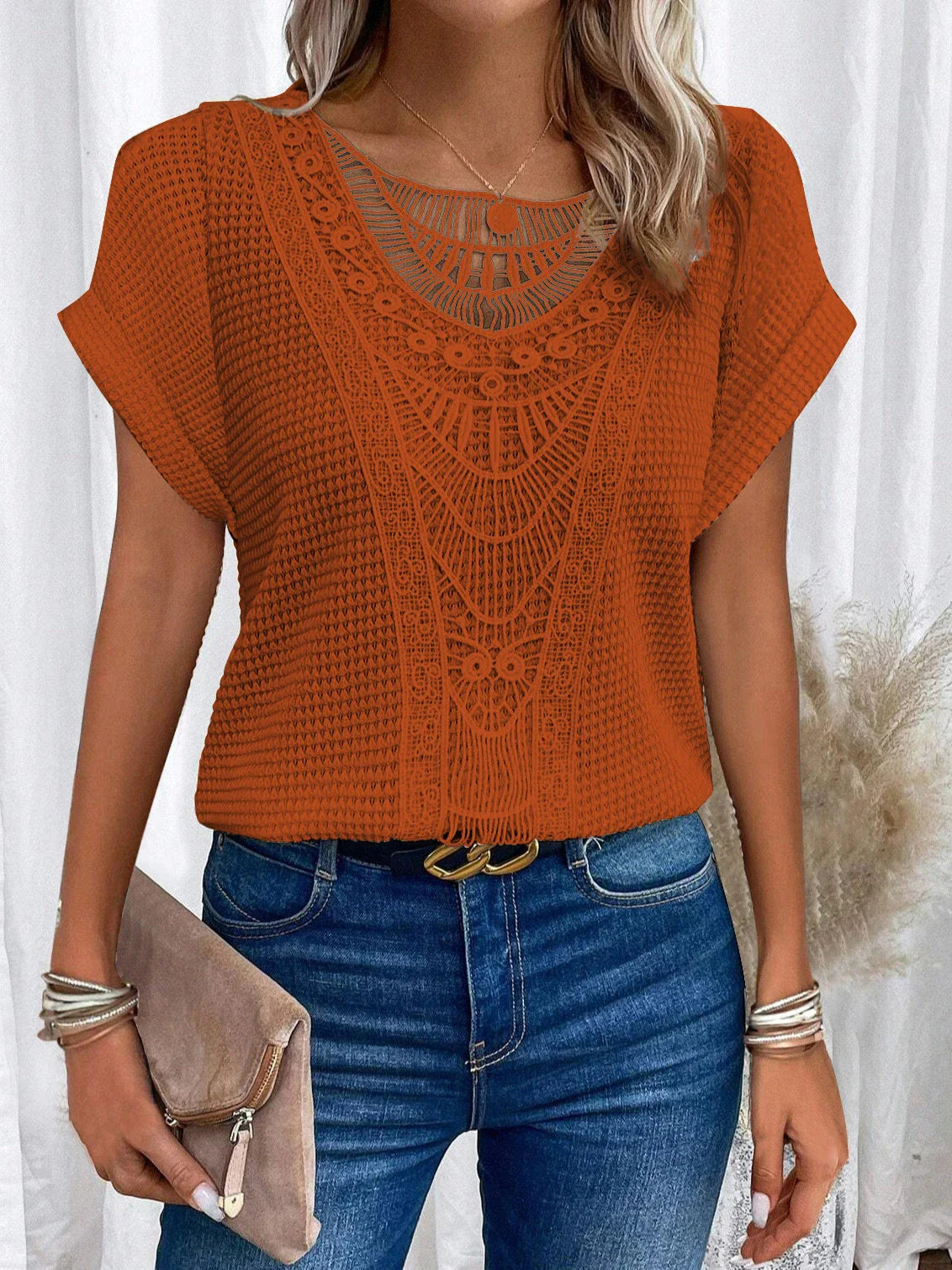 Women's short-sleeve tee in various colors, featuring a unique hollow-out design and soft, comfortable polyester fabric
