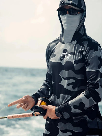 Huk Pursuit long sleeve fishing shirt with mesh side panels and crew neck, shown in an outdoor setting