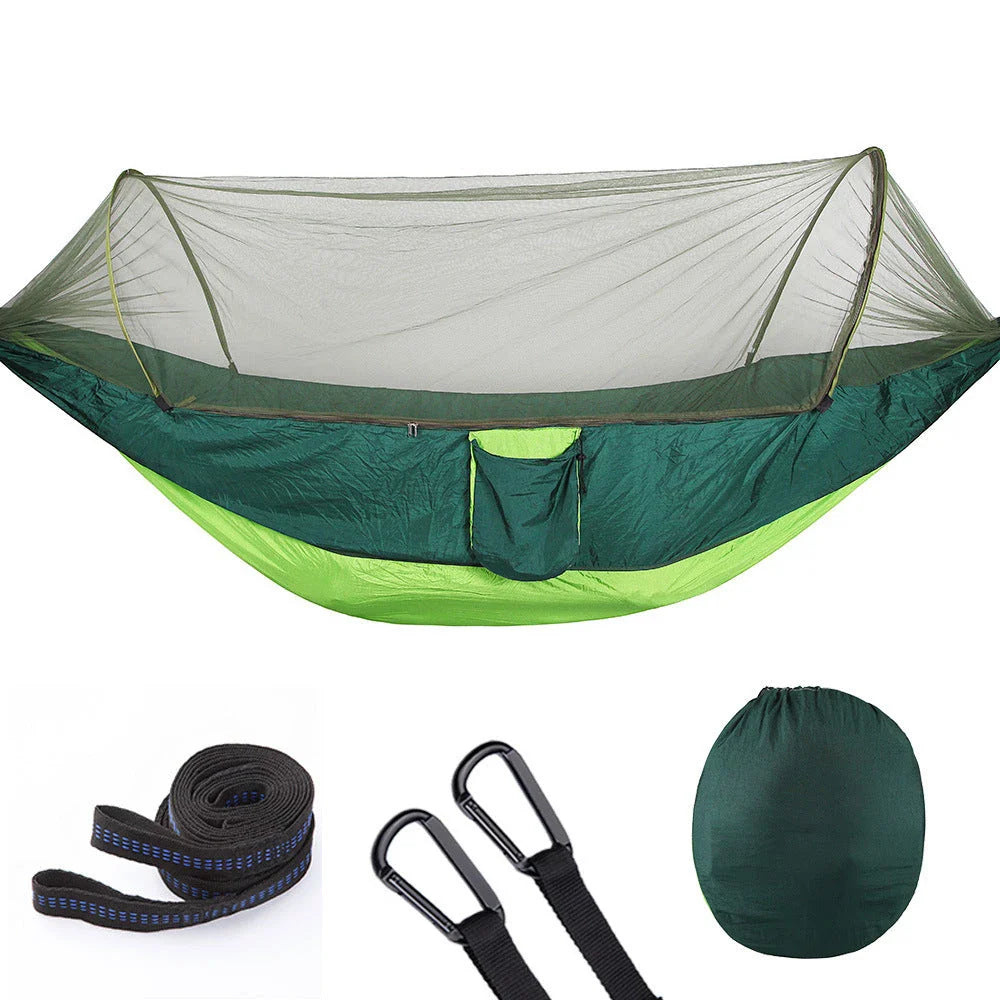 Cozy outdoor hammock with mosquito net for relaxing in nature and outdoor adventures