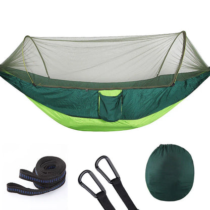 Cozy outdoor hammock with mosquito net for relaxing in nature and outdoor adventures