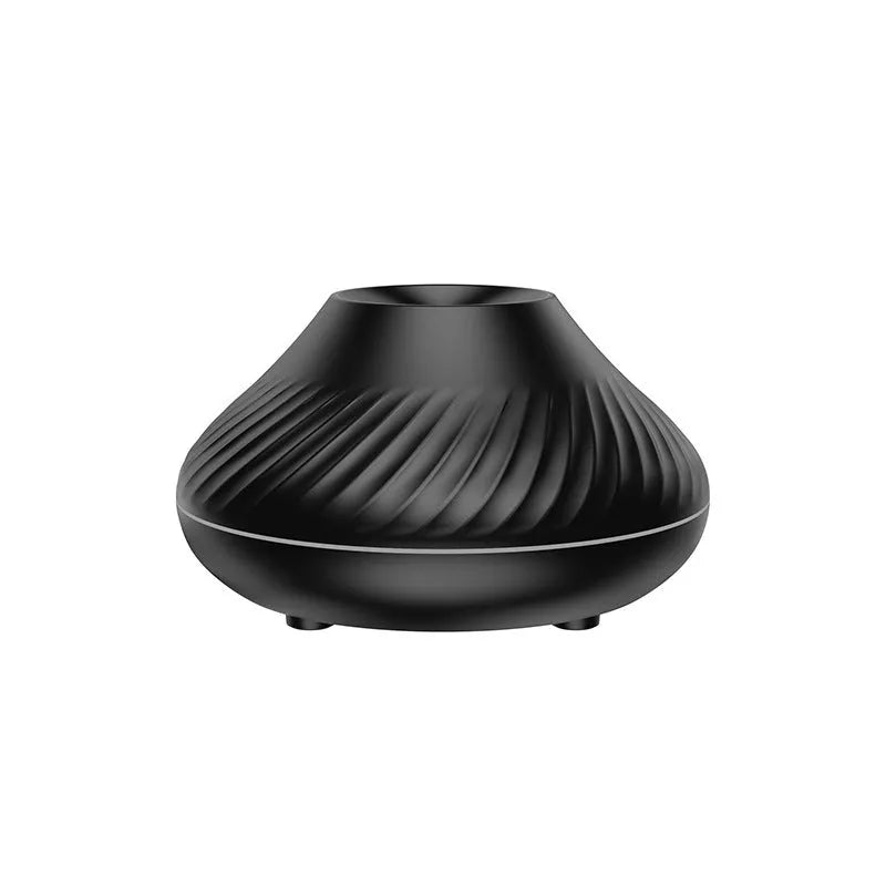 Beige volcanic flame aroma diffuser with LED lighting and mist output on wooden surface
