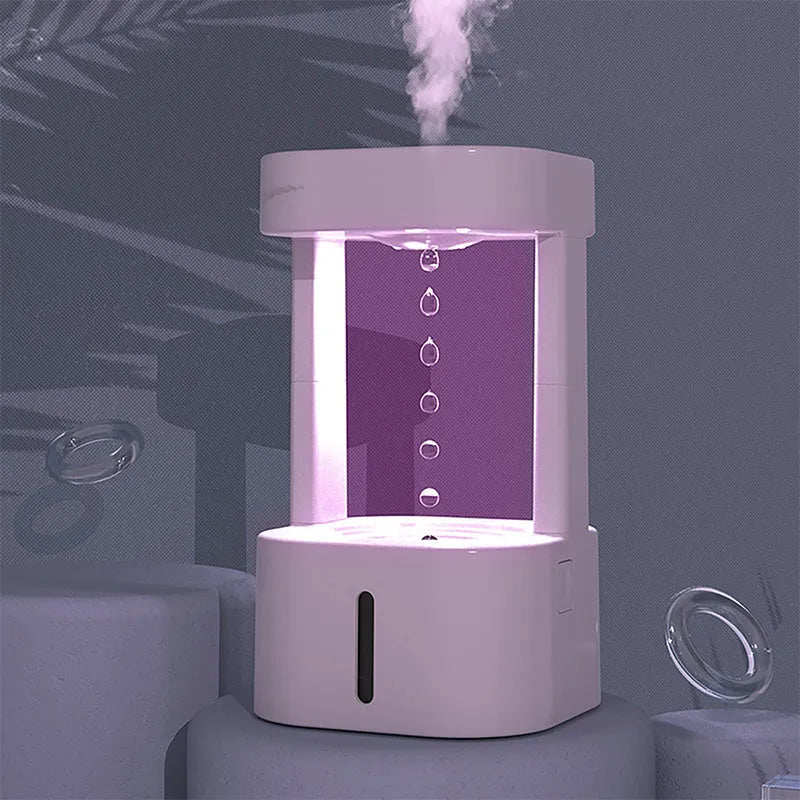 Creative anti-gravity water drop humidifier with upward flowing droplets and coloured lights