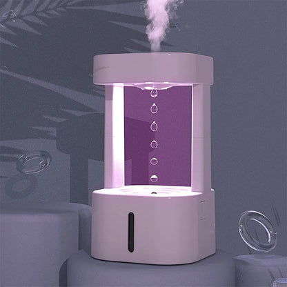 Creative anti-gravity water drop humidifier with upward flowing droplets and coloured lights
