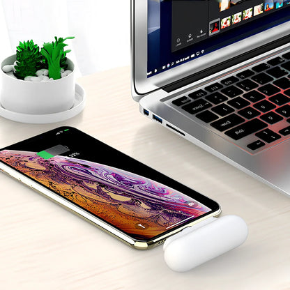 Black and white magnetic mini power bank showing compact dimensions and interchangeable charging heads