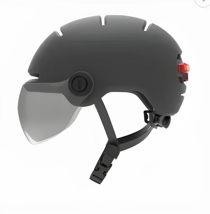 Cycling helmet with integrated automatic LED brake light system, showing PC shell construction