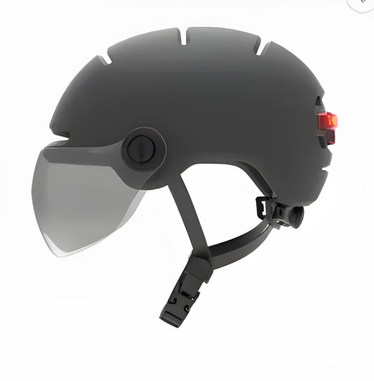 Cycling helmet with integrated automatic LED brake light system, showing PC shell construction