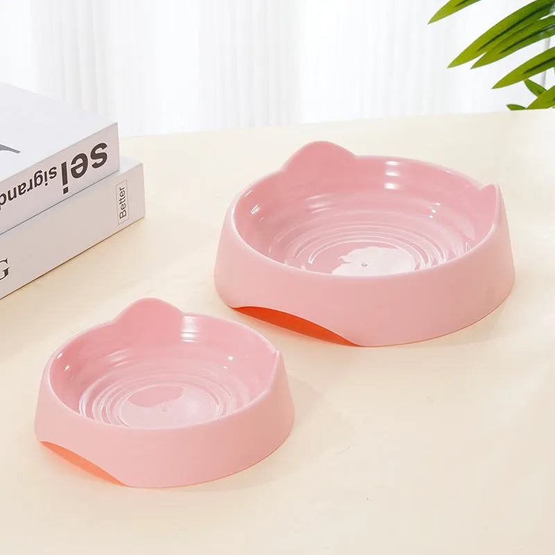 Blue ceramic dog bowl with raised central maze design for slowing fast-eating dogs.