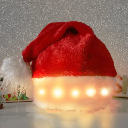 Red and white plush Santa hat with LED lights around brim in Christmas setting