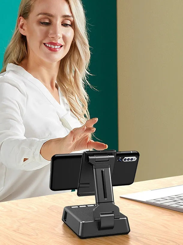 Black mobile phone broadcasting stand with Bluetooth speaker and HD microphone on desk