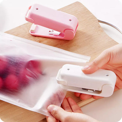 Home Portable Mini Sealing Machine in white and pink with optional magnetic closure