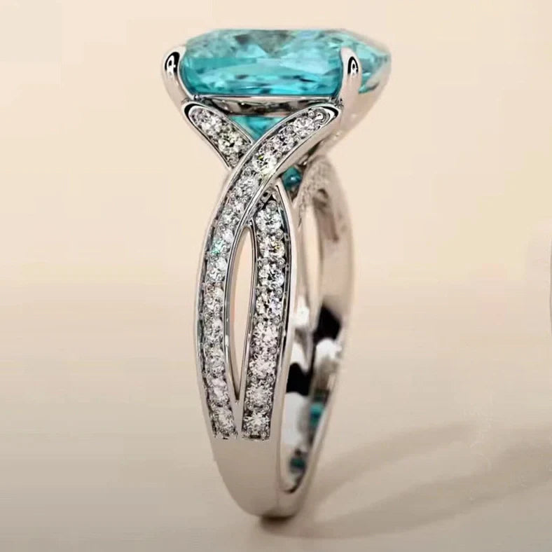Adjustable women's ring with 4mm square blue zircon stone on silver-tone band