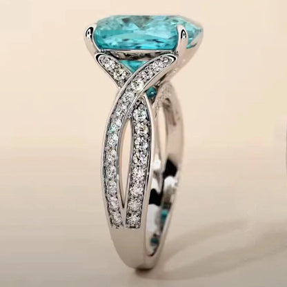 Adjustable women's ring with 4mm square blue zircon stone on silver-tone band