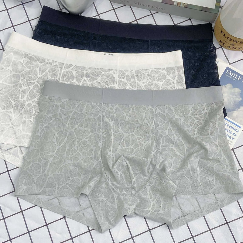 Thin lace leopard jacquard men's underwear in middle waist style available in multiple sizes L through 4XL with colour choices including mysterious black, elegant white, high-grade grey, matcha green and light rice apricot.