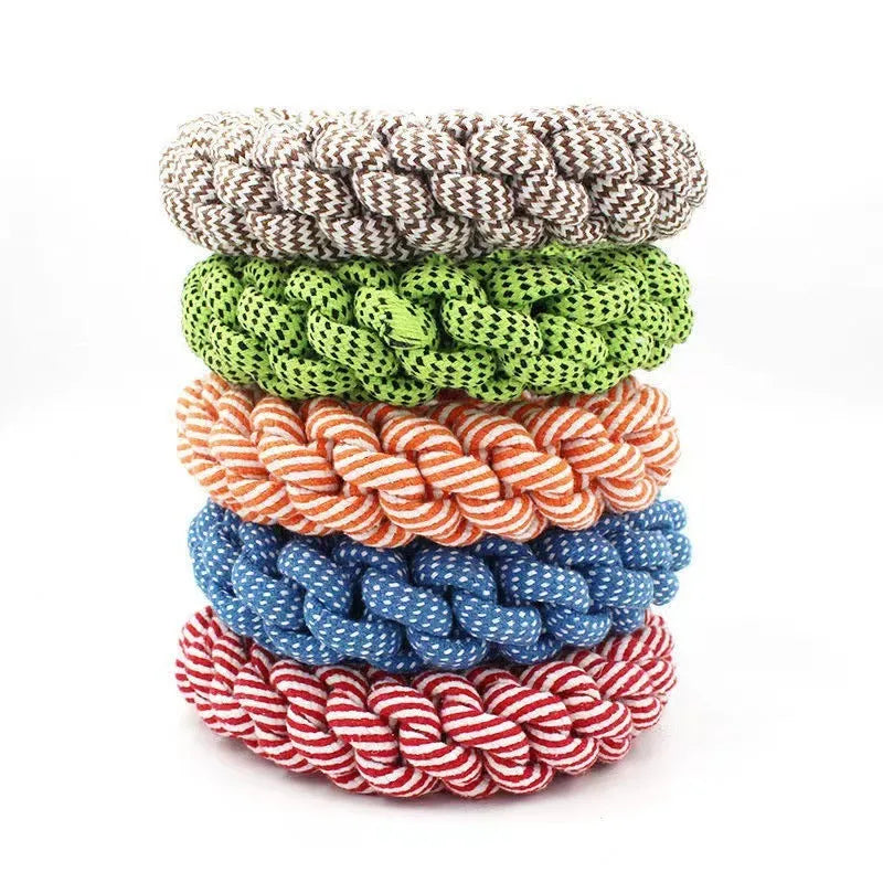 Cotton string braided ring knot dog chew toy showing woven texture and ring shape