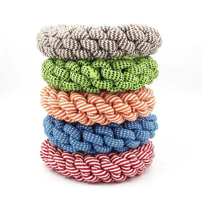 Cotton string braided ring knot dog chew toy showing woven texture and ring shape