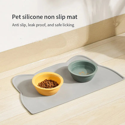 Blue silicone pet feeding mat in cat head shape for dog and cat food bowls