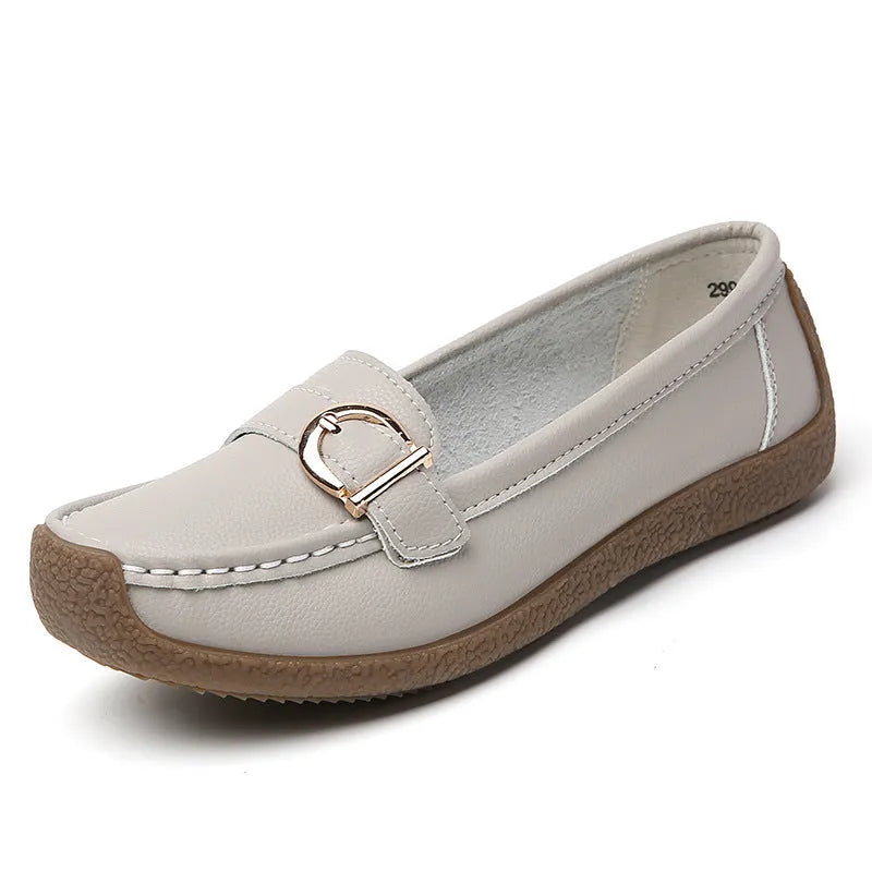 Women's beige casual loafers with round toe and flat heel on a white background.