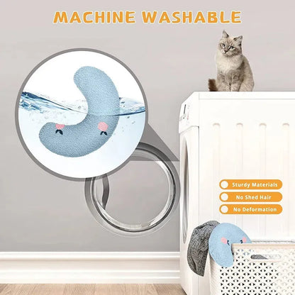 White U-shaped pet pillow measuring 27cm with raised rim supporting small cat's neck and back