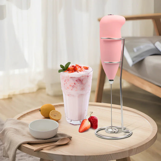 Green electric milk frother measuring 21cm tall with 5cm base creating milk foam