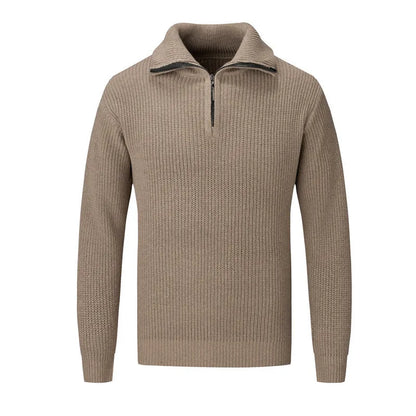 A man wearing a solid-colour slim-fit loose pullover sweater in a neutral colour.