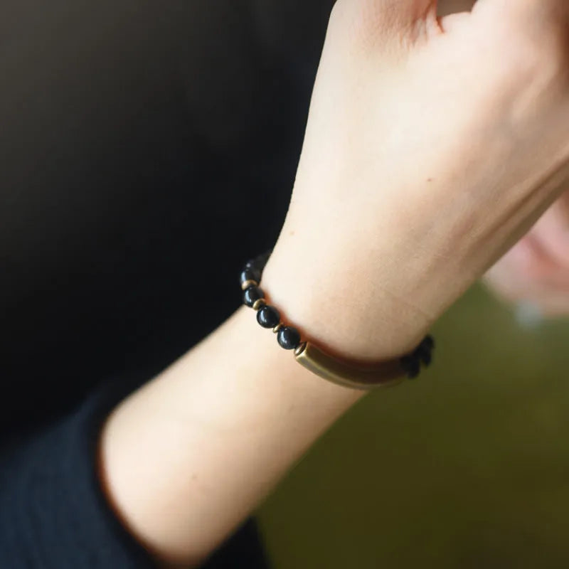 Layered retro ethnic bracelet for men and women with stone beads and brass spacers.