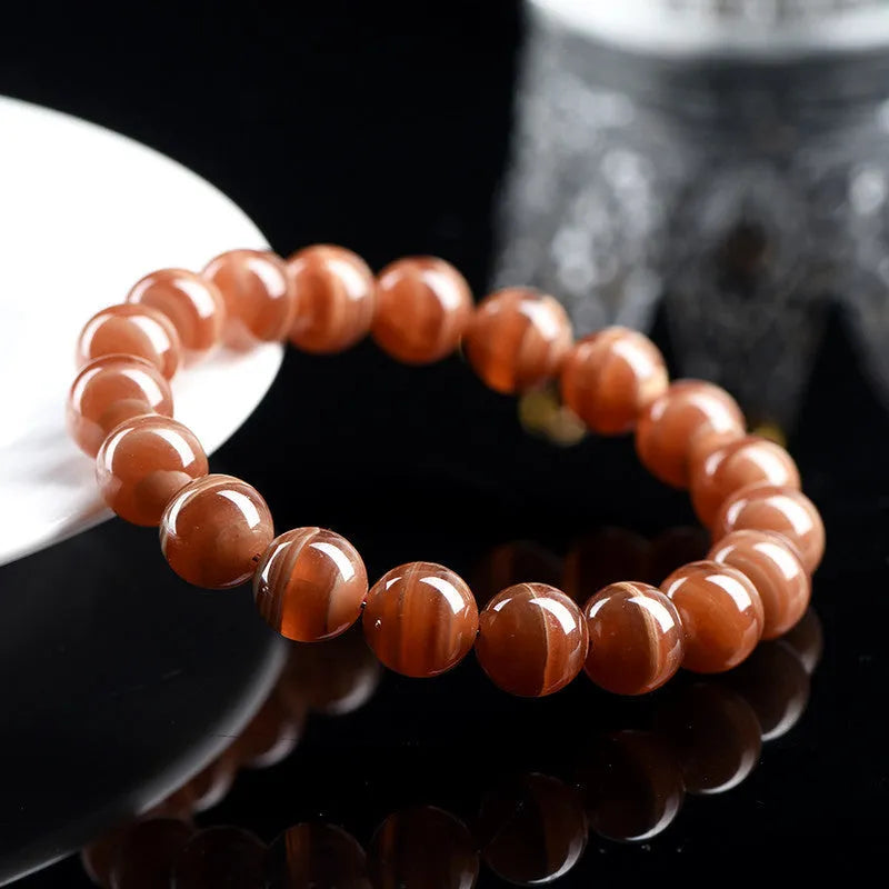 Natural old mine rhodochrosite bracelet with round geometric beads showing manganese spar colour variations